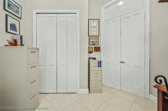 bedroom featuring light tile patterned floors