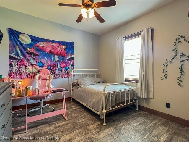 bedroom with hardwood / wood-style flooring and ceiling fan