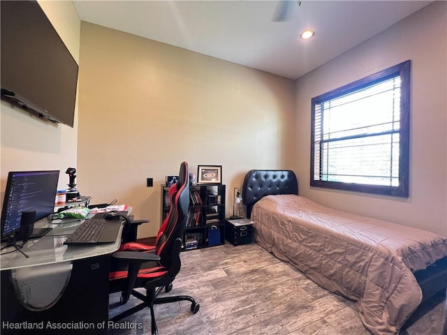 bedroom with light hardwood / wood-style floors