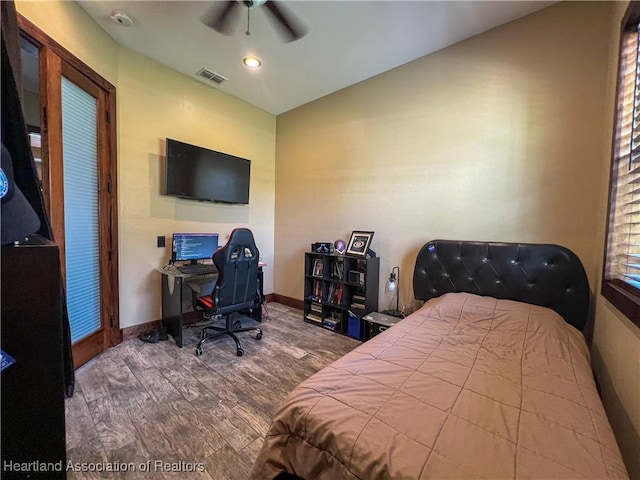 bedroom with hardwood / wood-style floors and ceiling fan