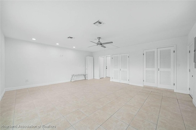 empty room featuring ceiling fan, visible vents, baseboards, and recessed lighting