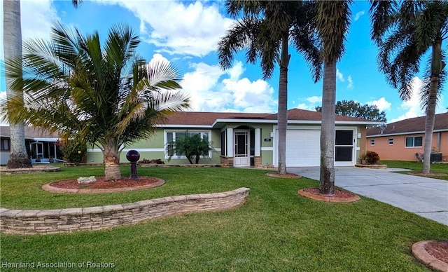 ranch-style home featuring central AC unit, a garage, and a front lawn