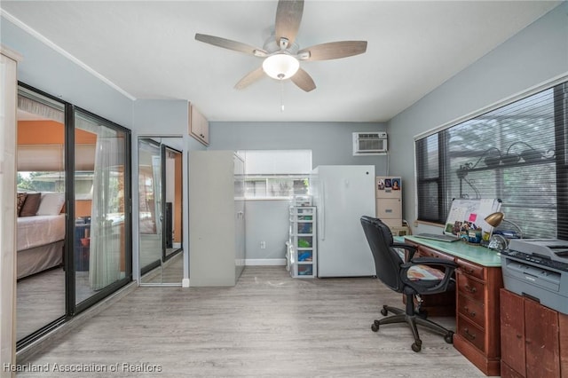 office area with ceiling fan, a wall mounted air conditioner, and light wood-type flooring