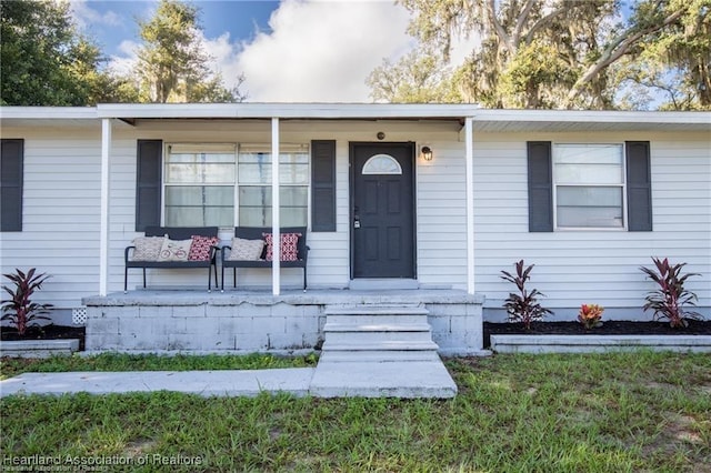 ranch-style home featuring a front yard