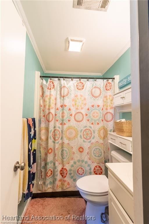 bathroom featuring crown molding, vanity, and toilet