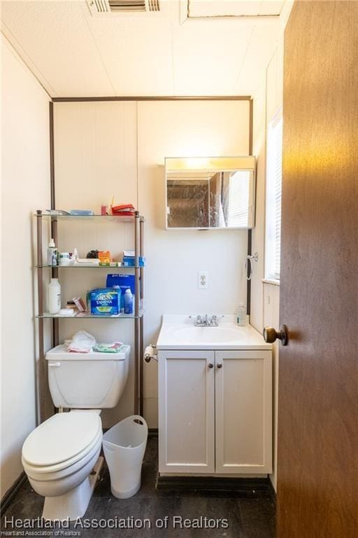 bathroom with vanity and toilet