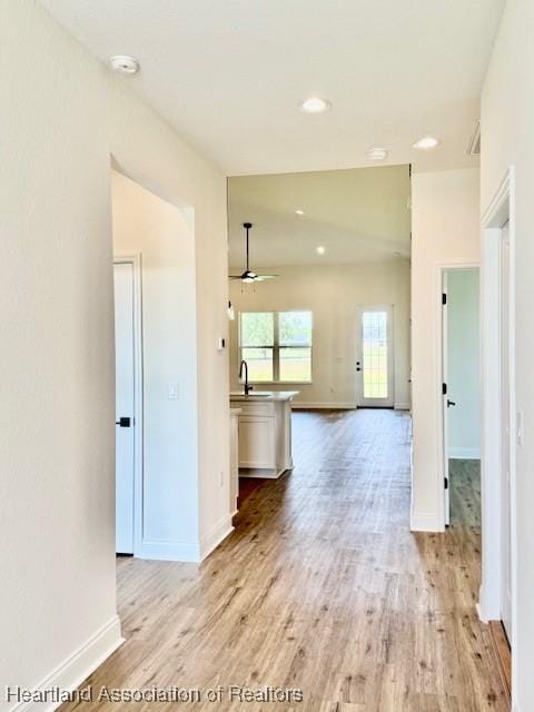 5279 Pebble Dr, Sebring, FL 33872 - interior space with a ceiling fan, baseboards, and light wood-style floors