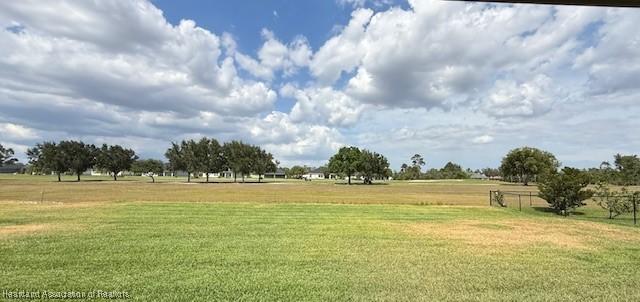 5279 Pebble Dr, Sebring, FL 33872 - surrounding community with a lawn