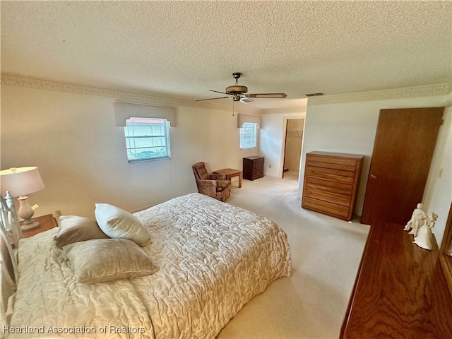 1704 Palm St, Sebring, FL 33870 - bedroom with crown molding, carpet floors, a textured ceiling, and a ceiling fan