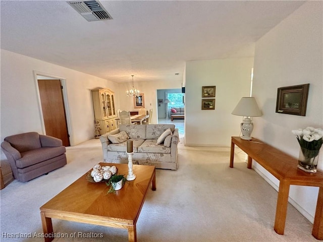 1704 Palm St, Sebring, FL 33870 - living room featuring light colored carpet and a chandelier