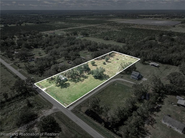 birds eye view of property featuring a rural view