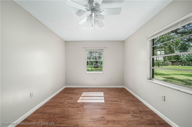 empty room featuring ceiling fan and wood-type flooring