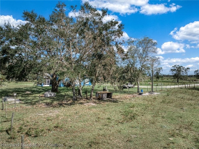 view of yard with a rural view