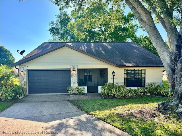 single story home with a garage, stone siding, roof with shingles, and concrete driveway