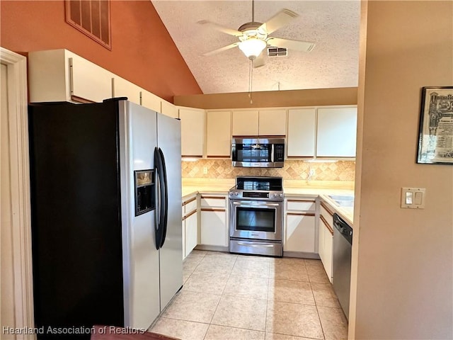 kitchen featuring visible vents, appliances with stainless steel finishes, a textured ceiling, and light countertops