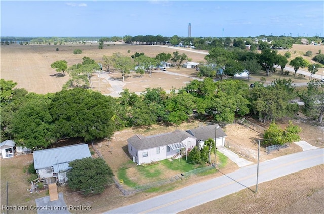 birds eye view of property with a rural view