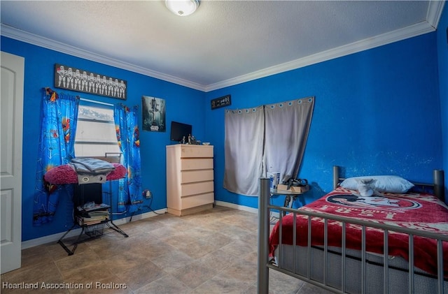 bedroom featuring crown molding and baseboards