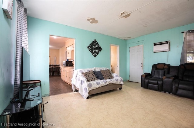 living room with tile patterned floors and a wall unit AC