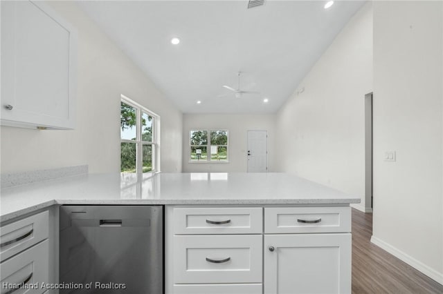 kitchen with kitchen peninsula, white cabinetry, dishwasher, and ceiling fan