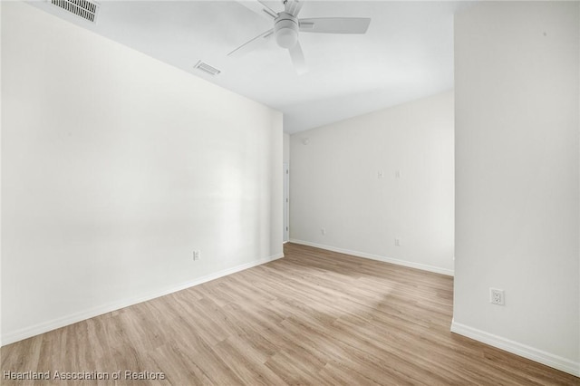 spare room with ceiling fan and light hardwood / wood-style floors