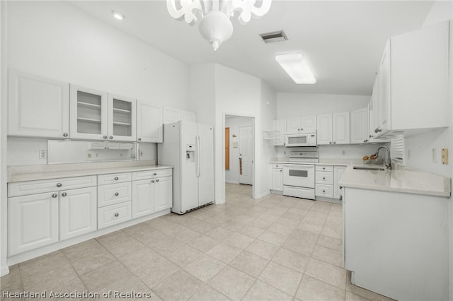 kitchen featuring white cabinetry, sink, high vaulted ceiling, and white appliances