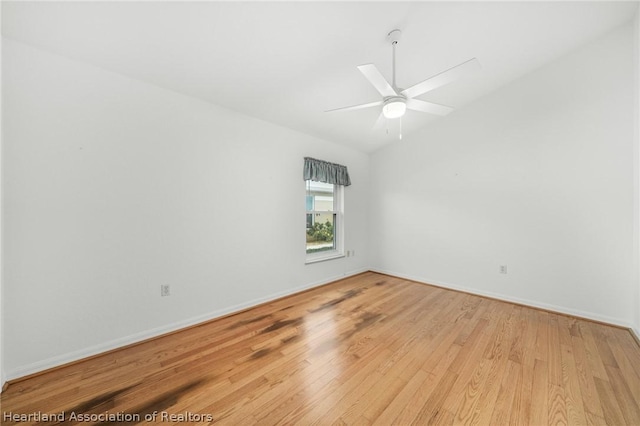 spare room with ceiling fan and light hardwood / wood-style floors