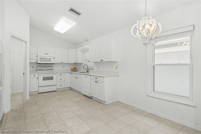 kitchen featuring white cabinets, white appliances, sink, and hanging light fixtures