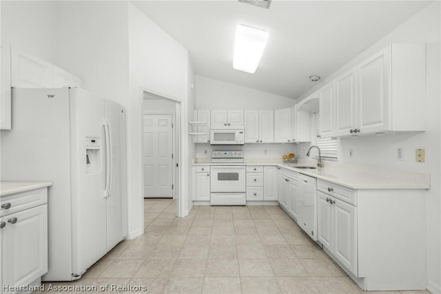 kitchen with lofted ceiling, sink, white cabinets, and white appliances