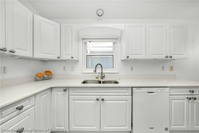 kitchen featuring dishwasher, white cabinetry, and sink