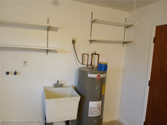 utility room with water heater and sink