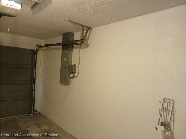 garage featuring a garage door opener and electric panel