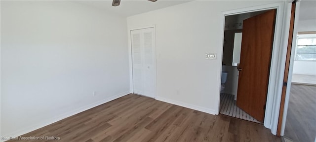 unfurnished room with dark hardwood / wood-style floors