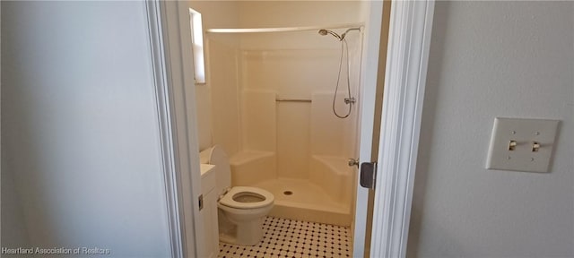 bathroom featuring toilet, vanity, and walk in shower