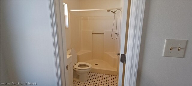 bathroom featuring toilet, vanity, and walk in shower