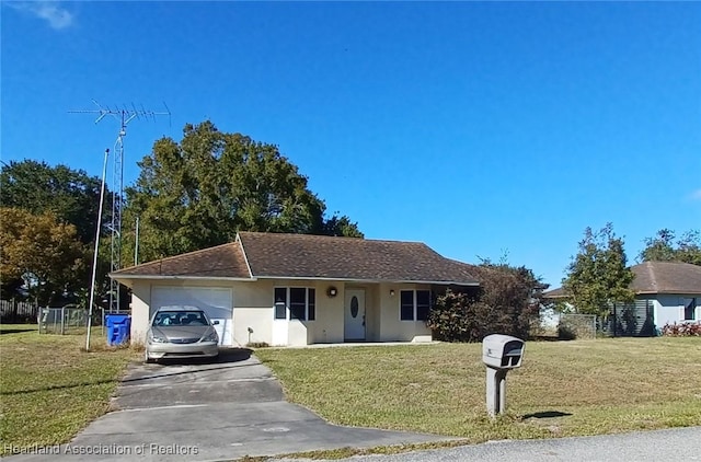 ranch-style house featuring a front yard and a garage