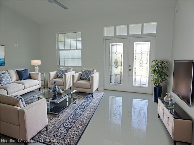 living room featuring a wealth of natural light and french doors