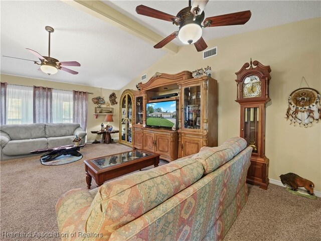 carpeted living area with vaulted ceiling with beams, baseboards, visible vents, and ceiling fan