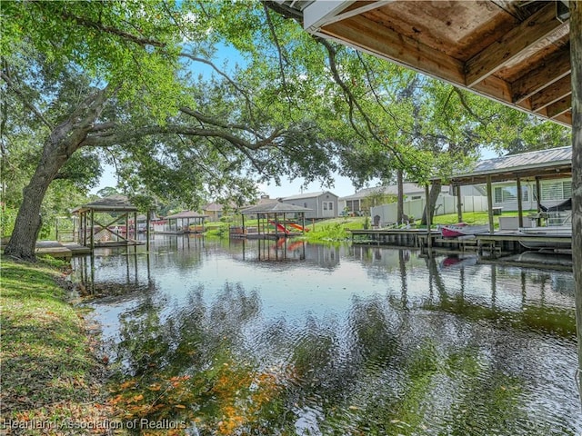 water view with a boat dock and a residential view