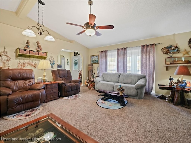 living area with lofted ceiling with beams, carpet floors, ceiling fan, and arched walkways