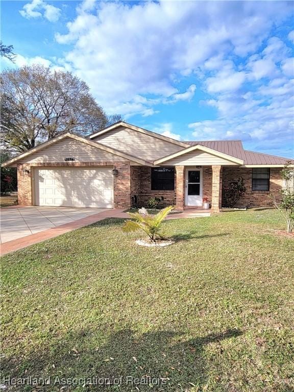 ranch-style house with a garage and a front yard