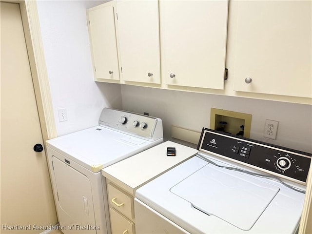 laundry room featuring washer and dryer and cabinet space