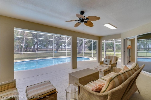 outdoor pool featuring a ceiling fan