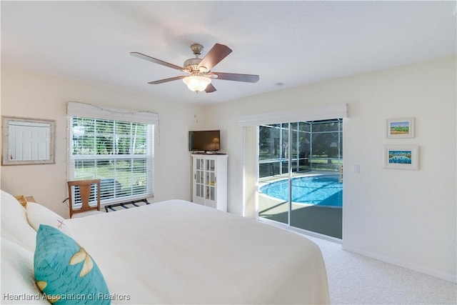 bedroom with ceiling fan, carpet floors, a sunroom, baseboards, and access to outside