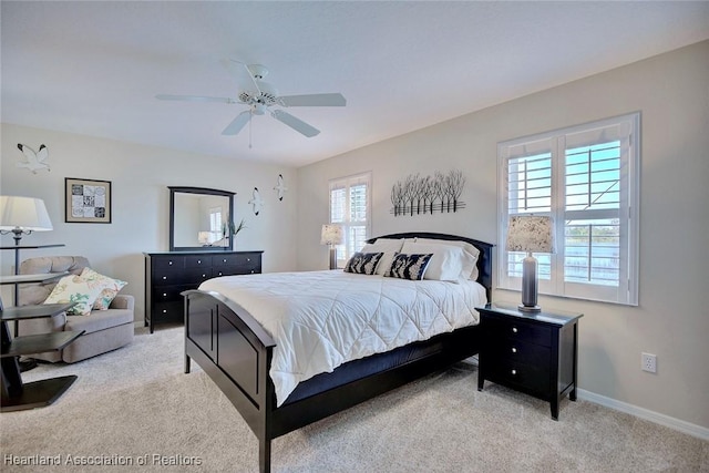 bedroom featuring ceiling fan and light colored carpet