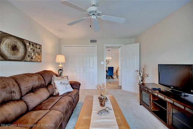 living room featuring ceiling fan and light colored carpet