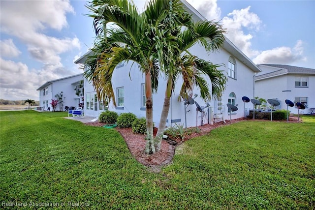 view of home's exterior featuring a lawn