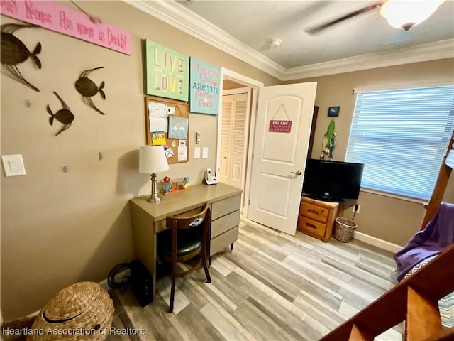 office area featuring ornamental molding and light hardwood / wood-style flooring