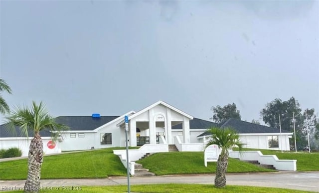 1015 Duane Palmer Blvd, Sebring, FL 33876 - view of front of house with a front lawn