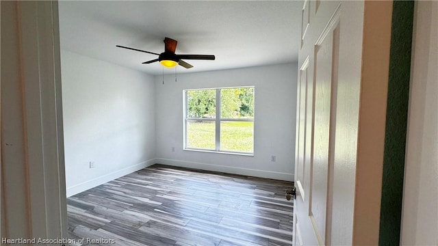 unfurnished room with wood-type flooring and ceiling fan