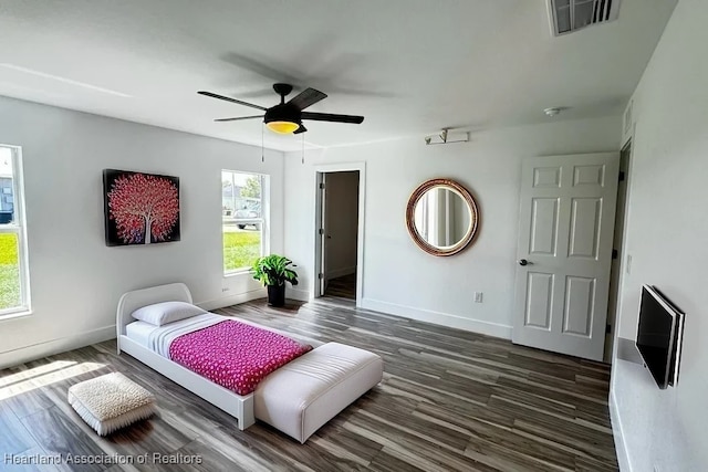 bedroom featuring ceiling fan and dark wood-type flooring